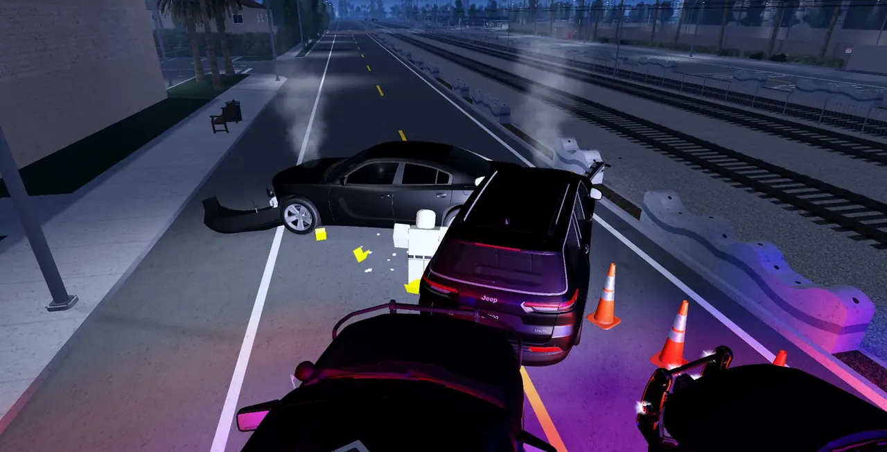 A crash scene on the highway with cones and a damaged car
