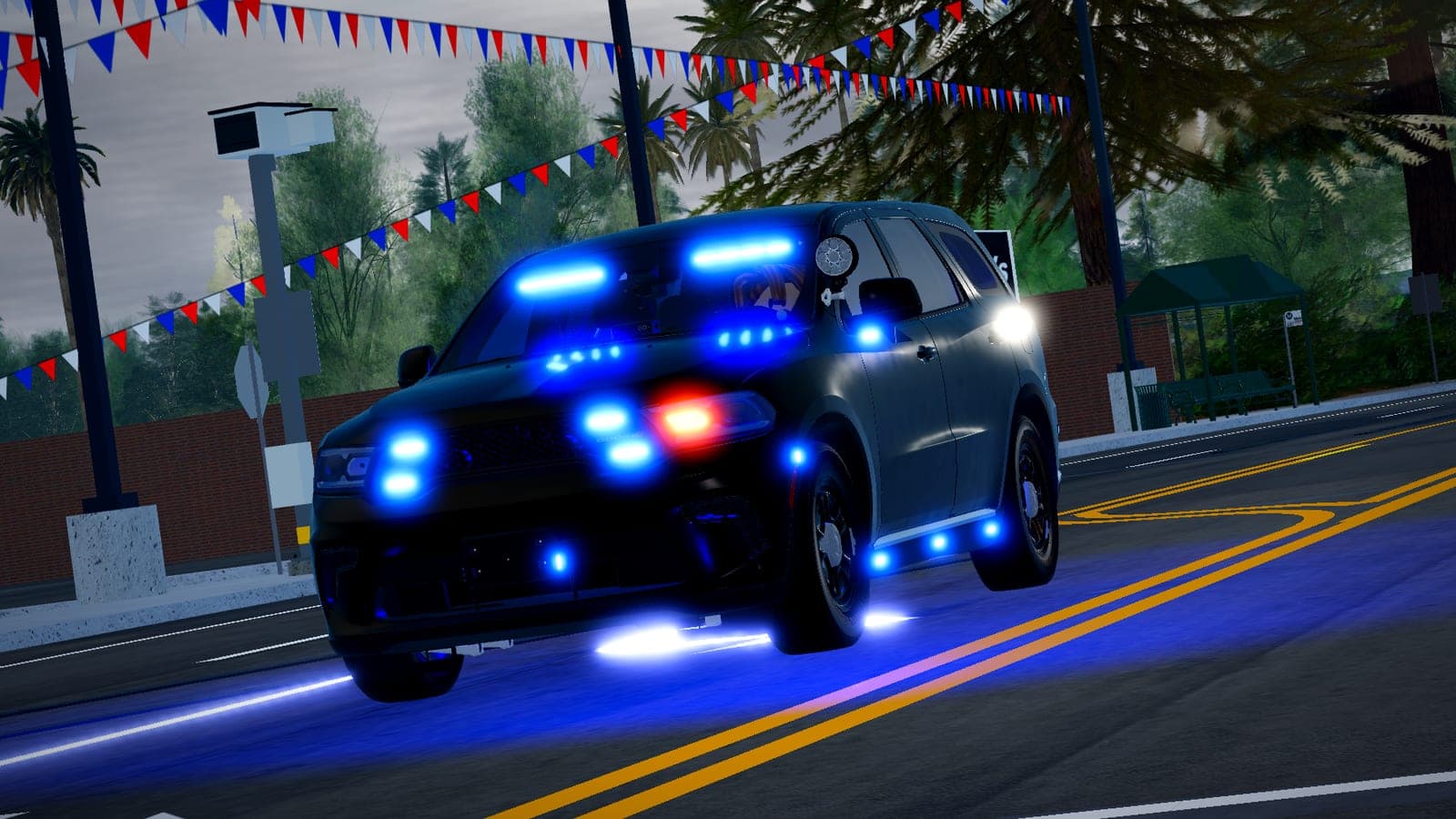 An unmarked Durango running blue lights under bunting